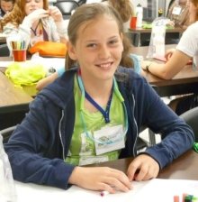 A photo of a young girl smiling.