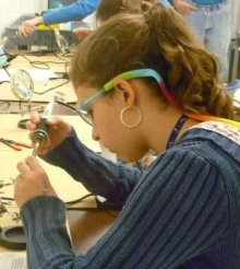 Photo of a student soldering.